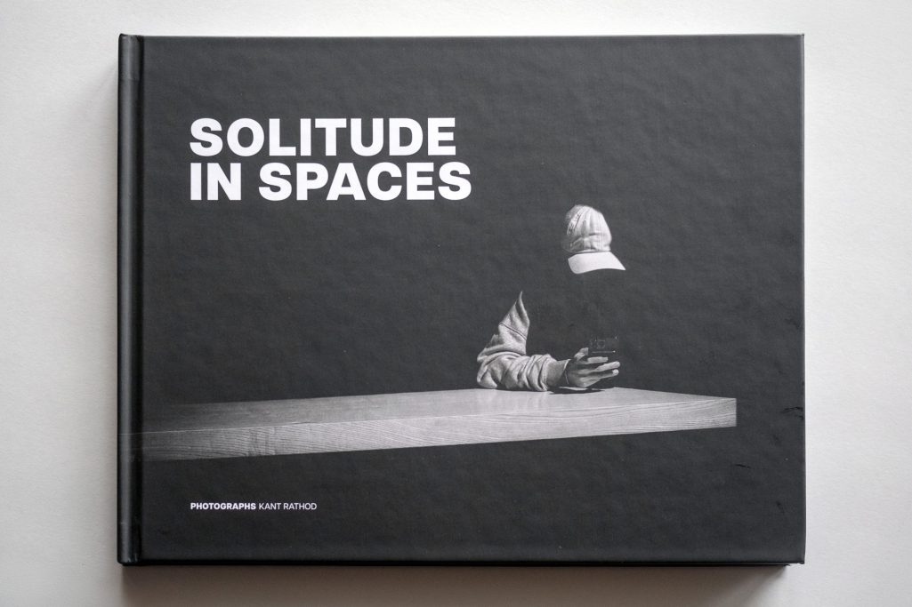 Book cover titled "Solitude in Spaces" featuring a minimalist design and monochrome elements.