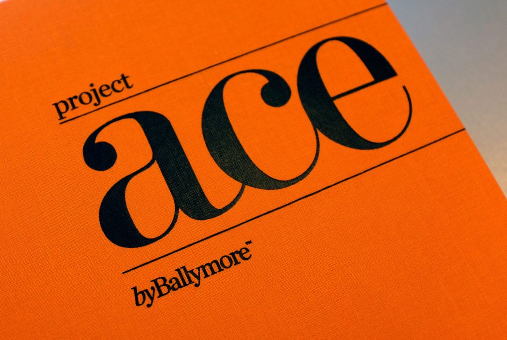 Logo of Project Ace on an orange background, featuring bold typography.